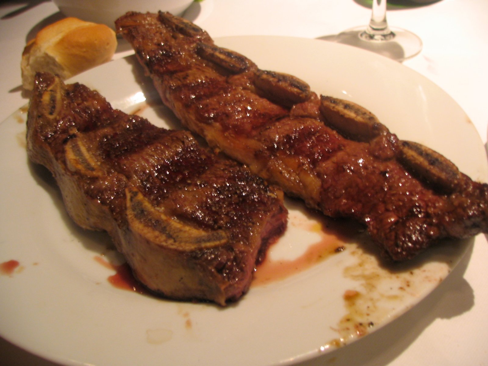 two pieces of grilled short ribs served on a plate, 2007